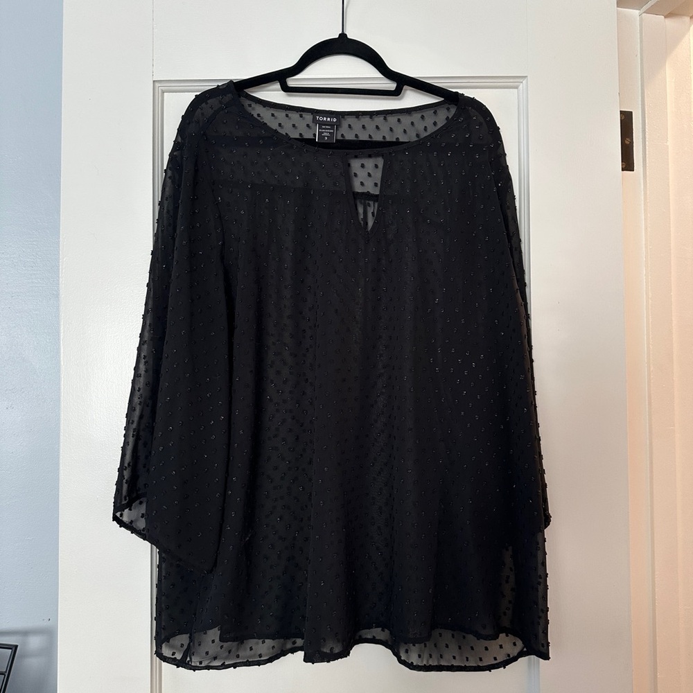 Torrid size 3 , see through black top with gold specs. Lightly worn